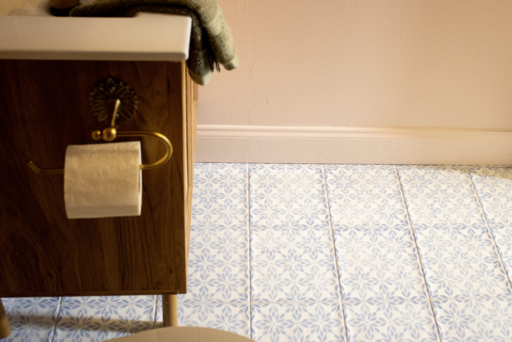 Blue floral patterned floor tile in our pink bathroom DIY remodel