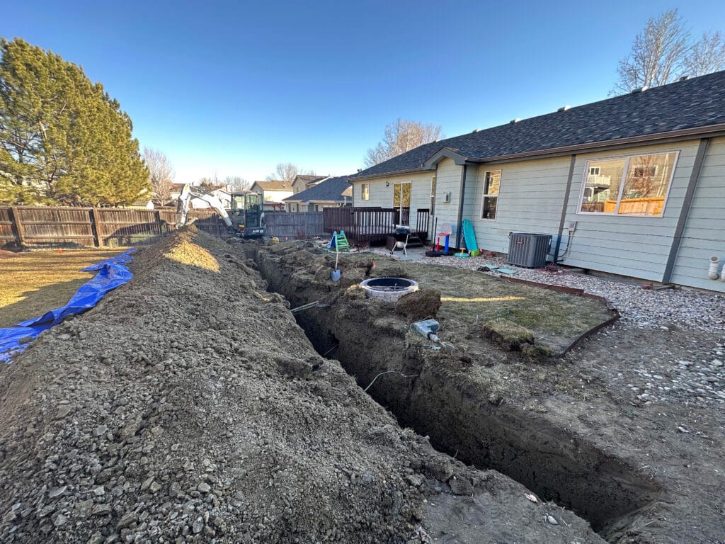 Backyard with a 3 foot trench dug
