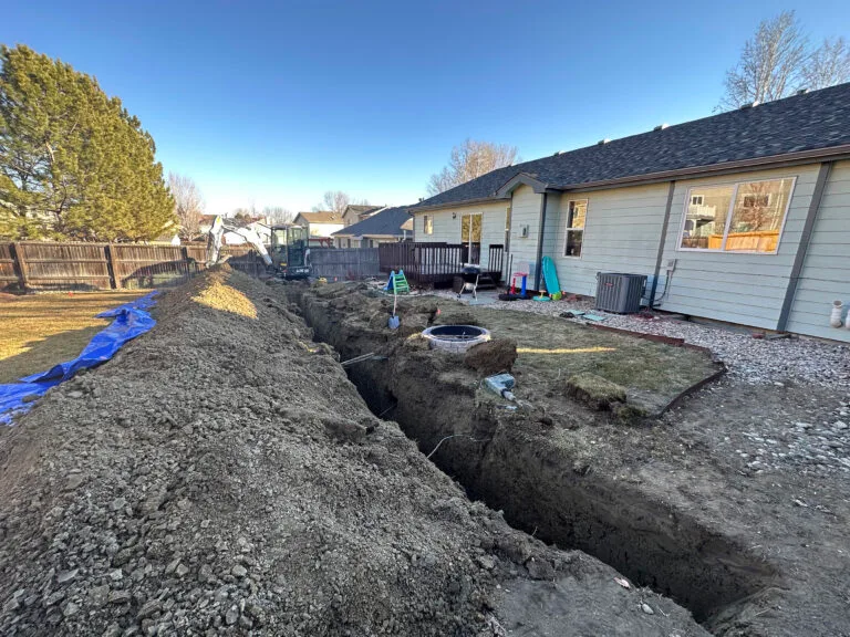 Backyard with a 3 foot trench dug