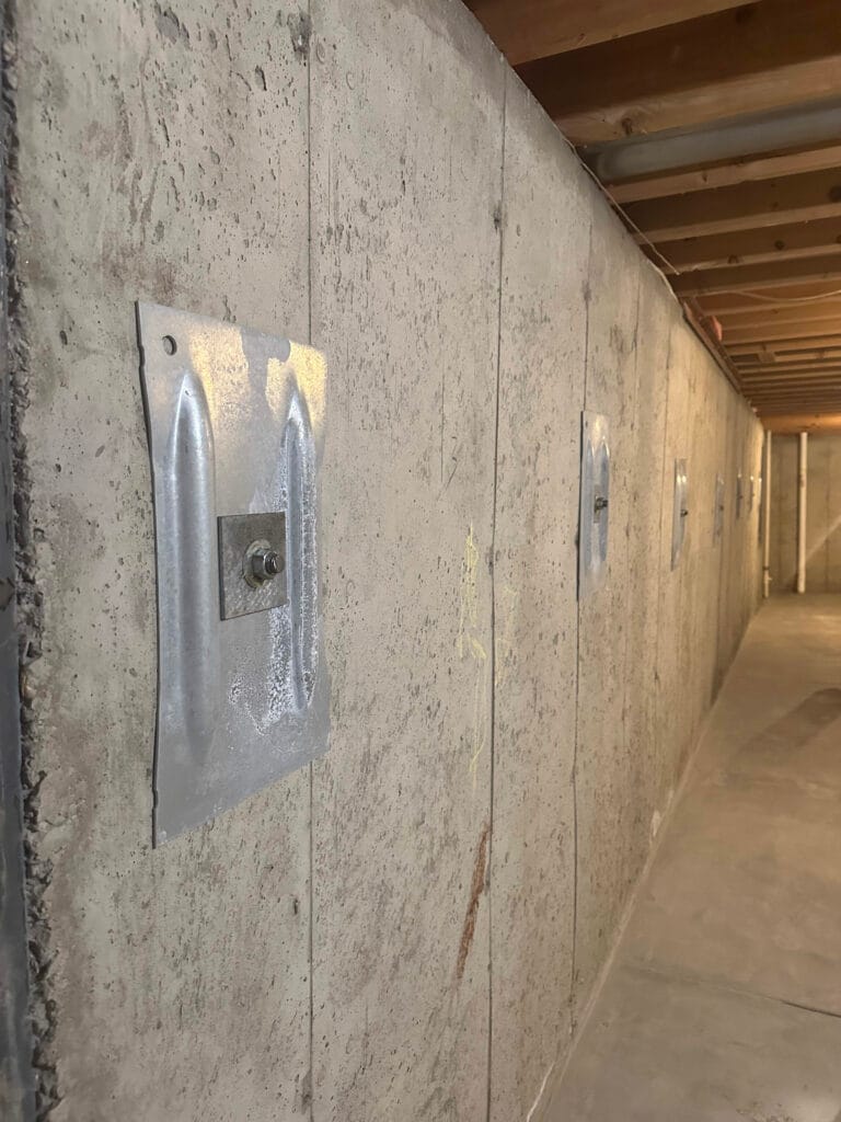 A Permanent Fix For Our Leaning Foundation: Foundation Wall Anchors