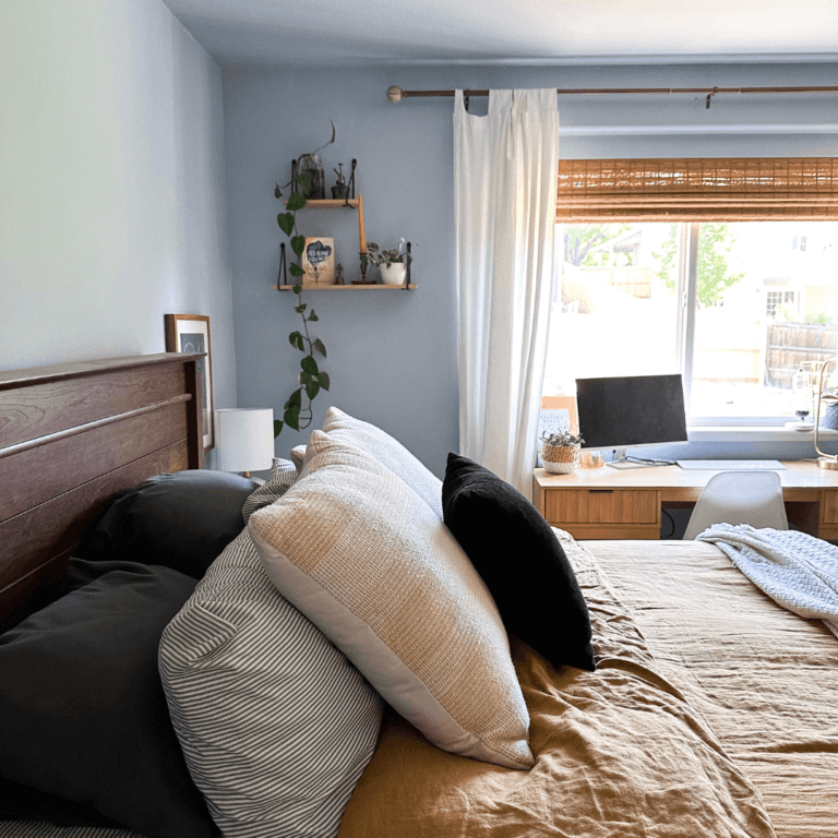 Blue bedroom with mustard yellow bed