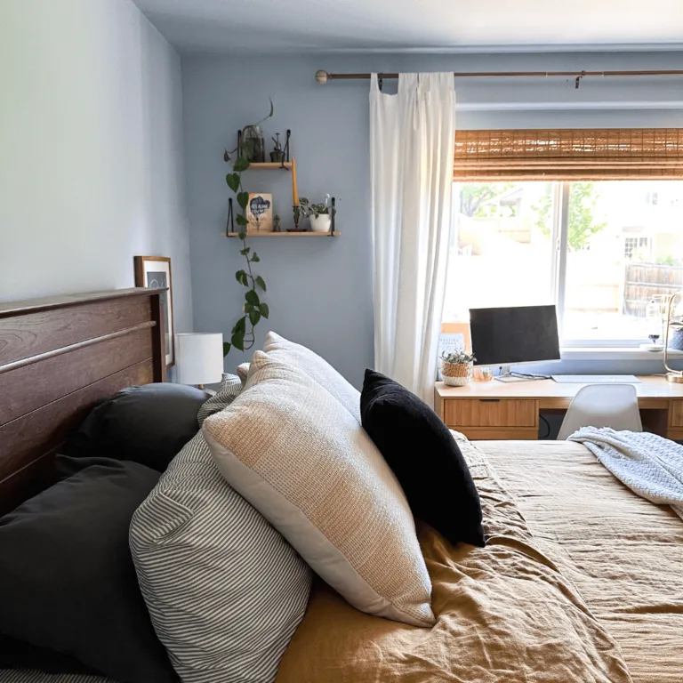 Blue bedroom with mustard yellow bed