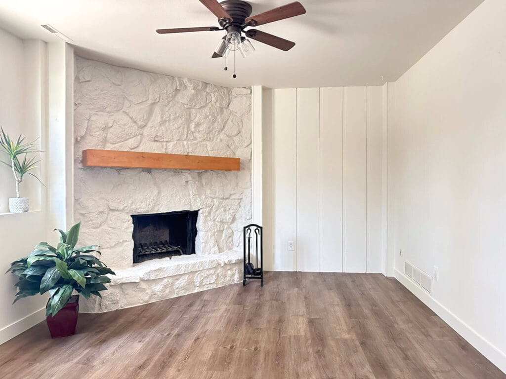 painted white fireplace in a white living room